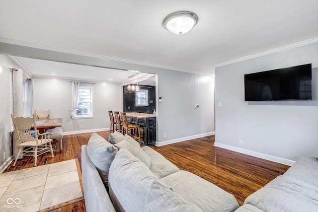 living room with ornamental molding and hardwood / wood-style flooring