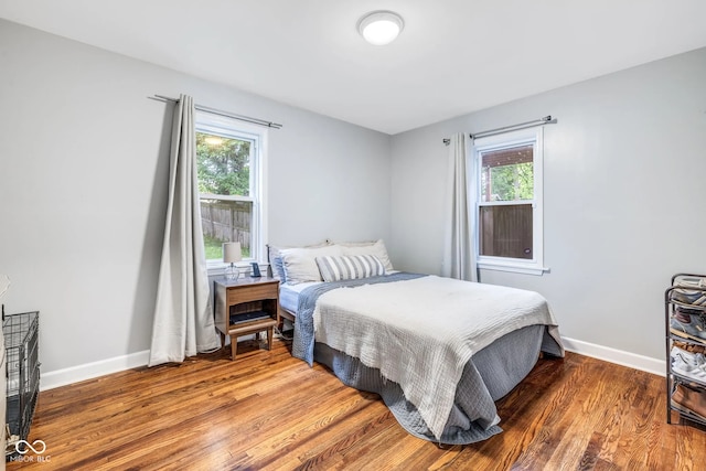 bedroom with hardwood / wood-style flooring