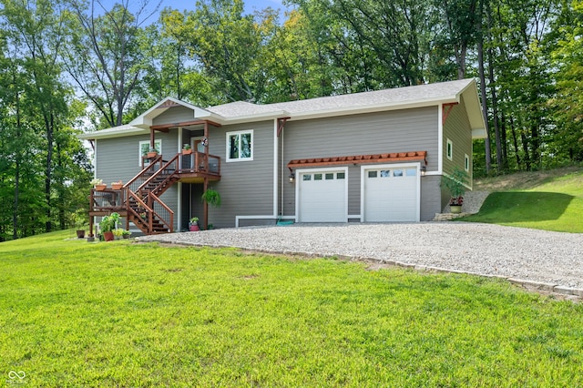 view of front of home featuring a wooden deck, a garage, and a front yard