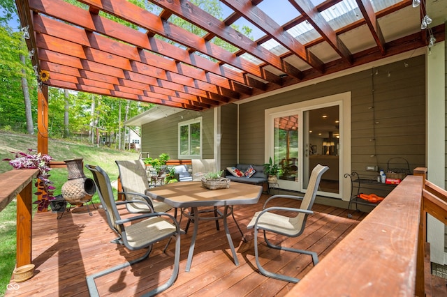 wooden terrace with an outdoor living space and a pergola