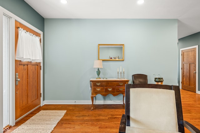 entryway with hardwood / wood-style floors