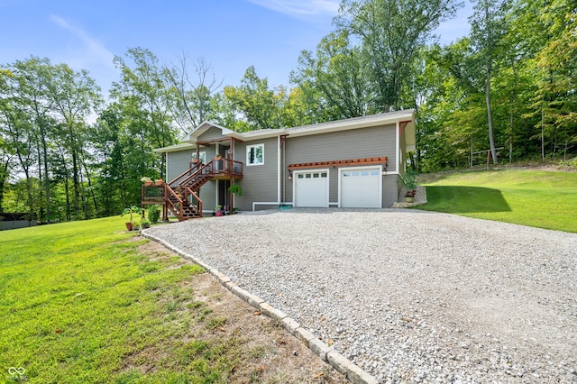 view of front facade featuring a front yard, a deck, and a garage