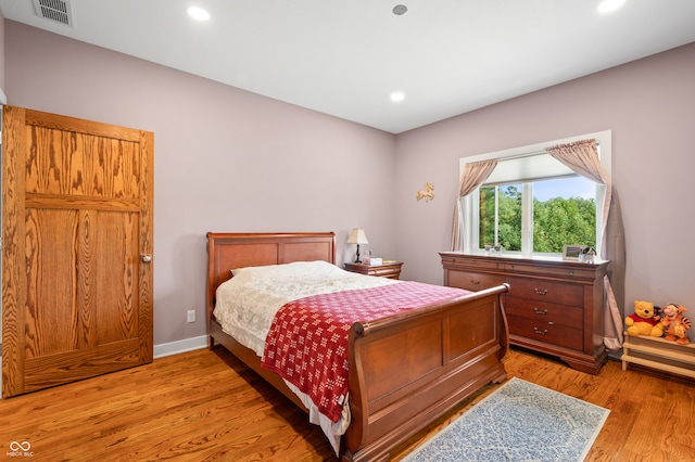 bedroom featuring light wood-type flooring