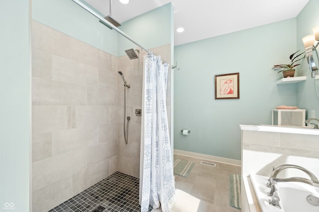 bathroom with tile patterned flooring and independent shower and bath