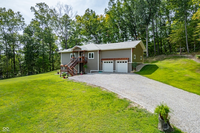 view of front of home featuring a garage and a front lawn