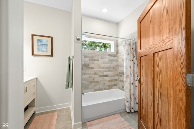 bathroom featuring tile patterned floors, shower / tub combo with curtain, and vanity