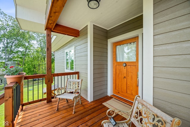 wooden terrace featuring covered porch