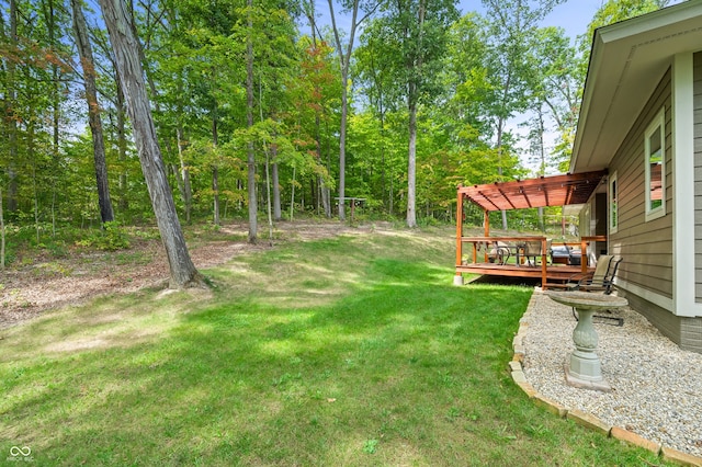 view of yard with a deck and a pergola