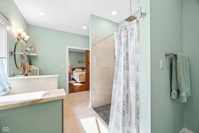 bathroom featuring vanity, a shower with curtain, and tile patterned floors