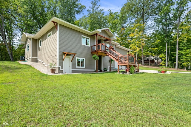 rear view of property featuring a yard, central AC, and a deck