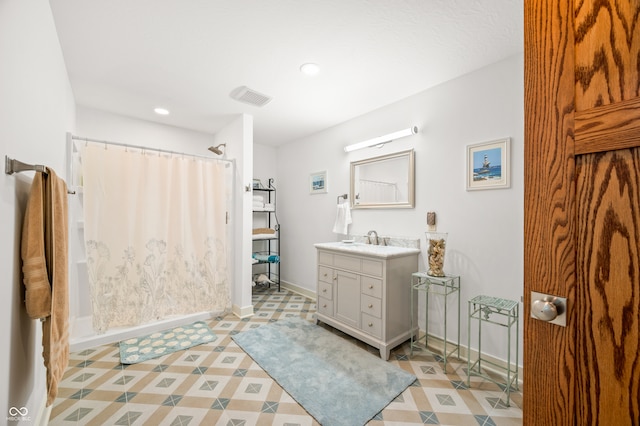 bathroom with vanity and curtained shower