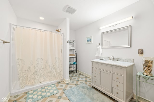 bathroom featuring vanity and walk in shower