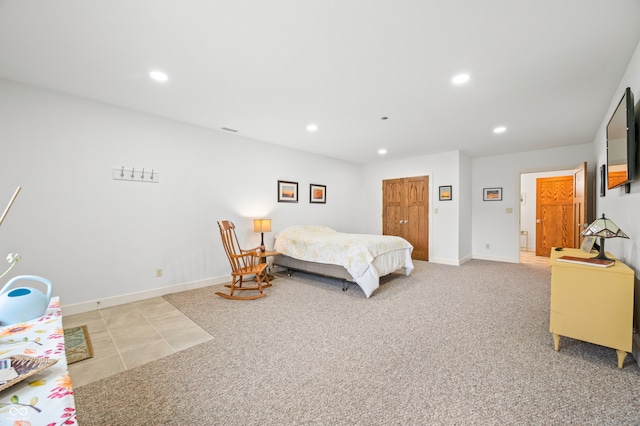 carpeted bedroom with a closet