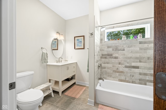 full bathroom with tile patterned flooring, vanity, toilet, and tiled shower / bath