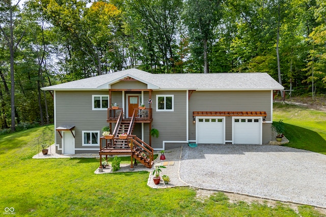 view of front of home with a garage and a front yard