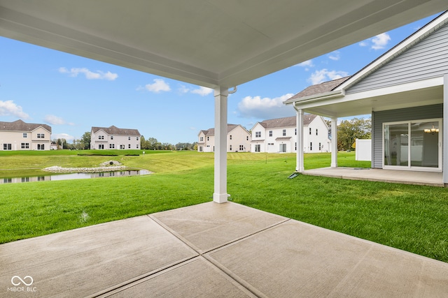 view of patio with a water view