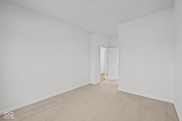 empty room featuring light colored carpet