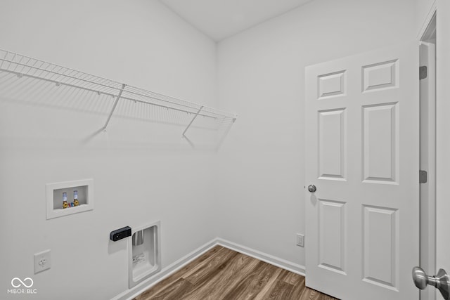 laundry area featuring dark hardwood / wood-style floors and hookup for a washing machine