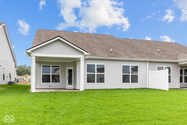 back of house featuring a yard and a patio area