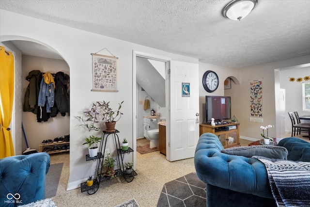 living room featuring a textured ceiling