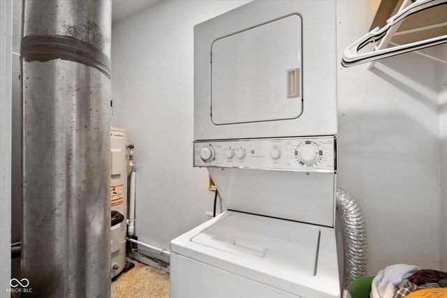 laundry area featuring stacked washer / drying machine