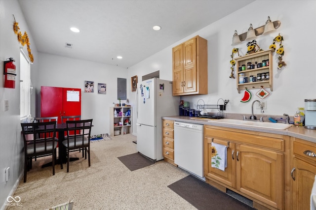 kitchen featuring white appliances and sink