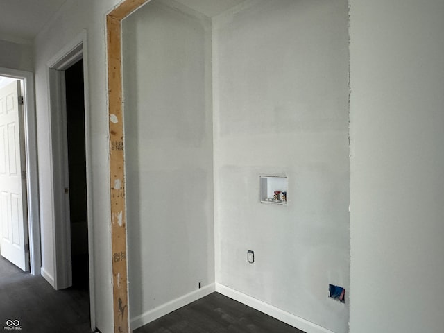 washroom with dark wood-type flooring and washer hookup