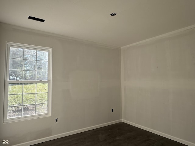 empty room with dark hardwood / wood-style floors