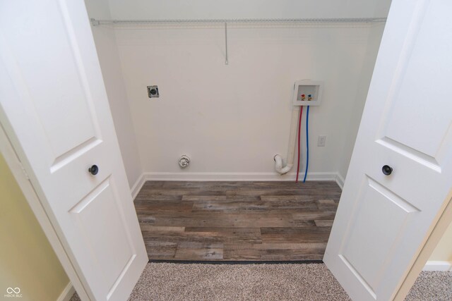 clothes washing area with hookup for a washing machine, dark hardwood / wood-style floors, and electric dryer hookup