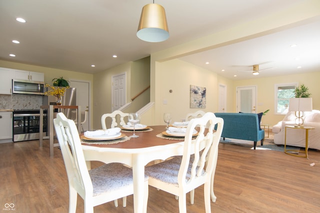 dining room featuring ceiling fan and light hardwood / wood-style floors