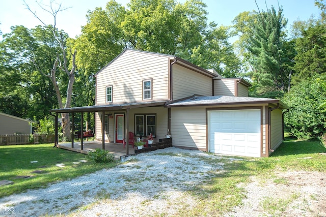 view of front of home with a porch, a garage, and a front lawn