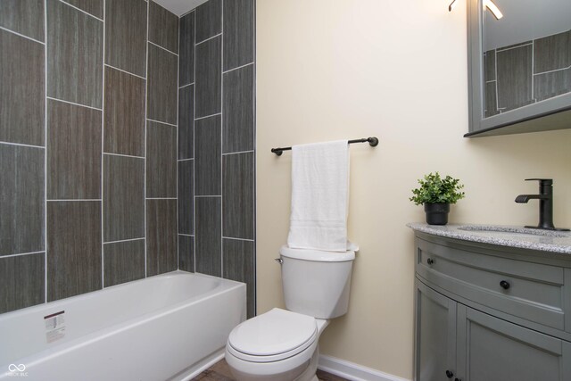 full bathroom featuring shower / tub combination, vanity, and toilet