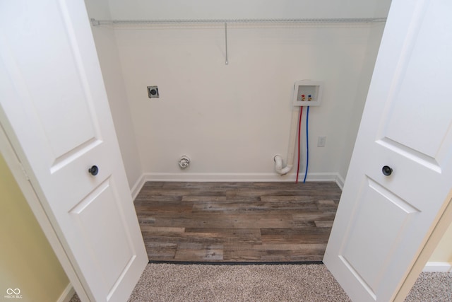 washroom featuring dark hardwood / wood-style flooring, washer hookup, and hookup for an electric dryer