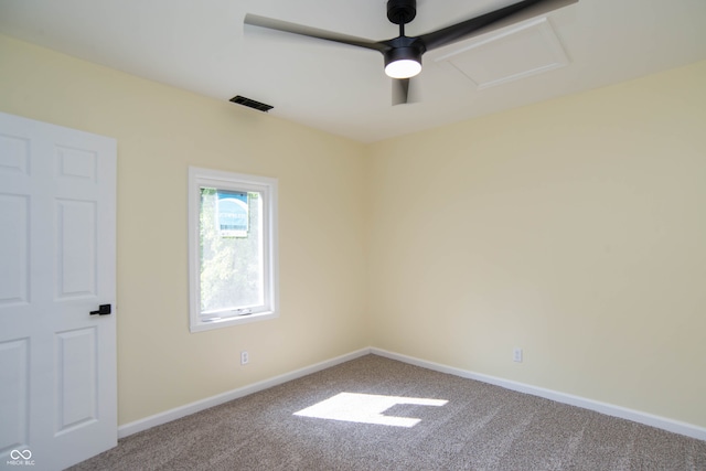 carpeted empty room featuring ceiling fan