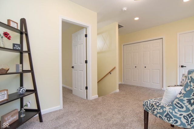 living area featuring light colored carpet