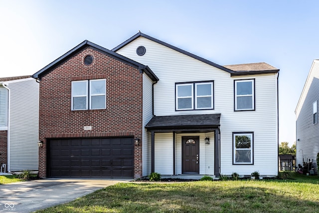 view of front of house featuring a garage and a front lawn