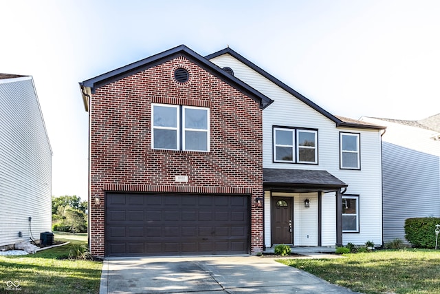 view of front of home featuring a front lawn and a garage