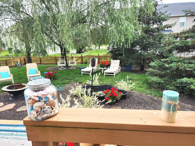 view of yard featuring an outdoor fire pit