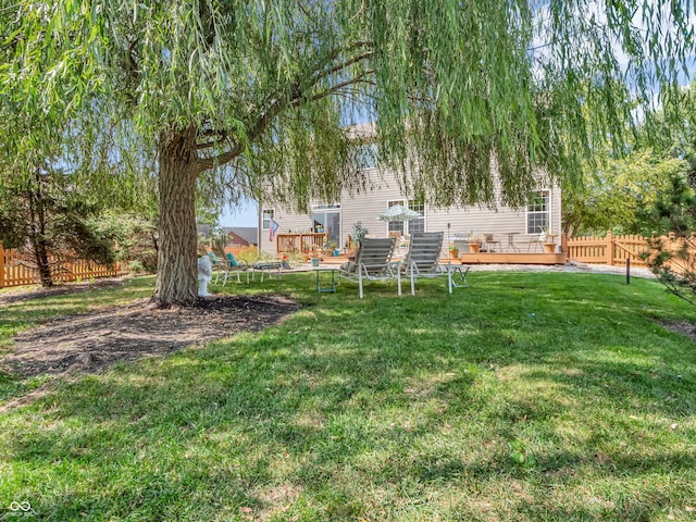 view of yard with a wooden deck