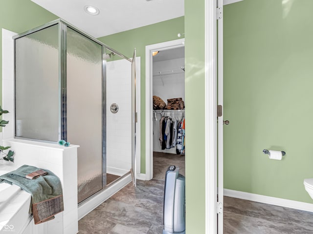 bathroom with a shower with door