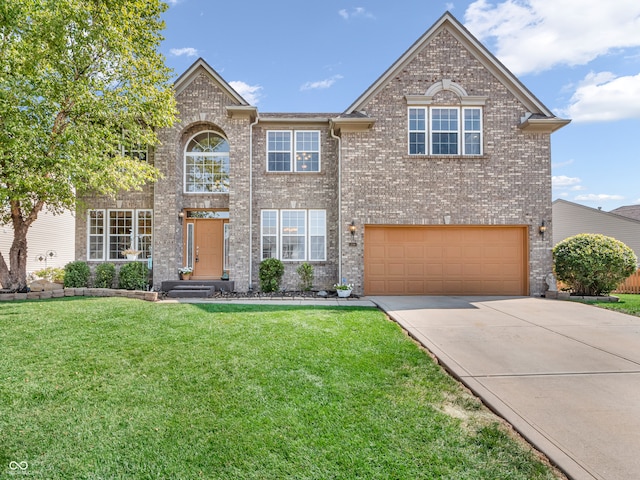 view of front of property featuring a garage and a front yard