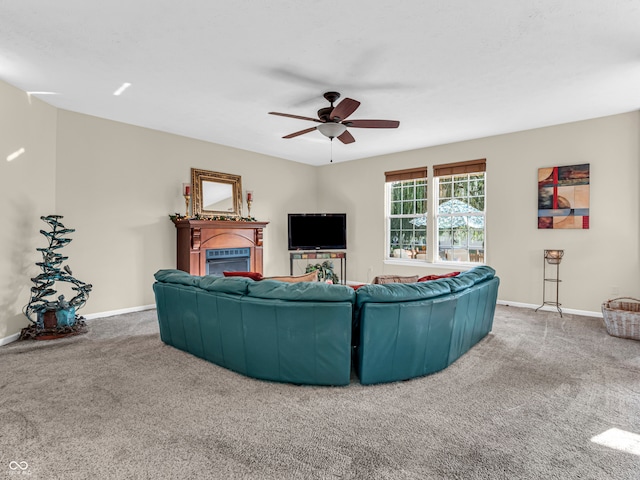 carpeted living room featuring ceiling fan