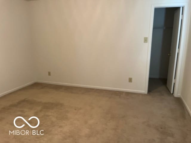 empty room featuring carpet floors