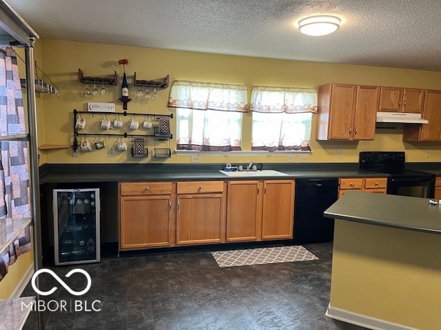 kitchen featuring sink, dark tile patterned floors, a textured ceiling, beverage cooler, and black appliances