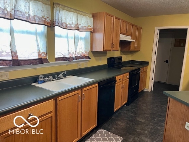 kitchen featuring sink, a textured ceiling, and black appliances