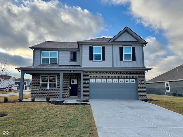 view of front of house with a garage and a front yard