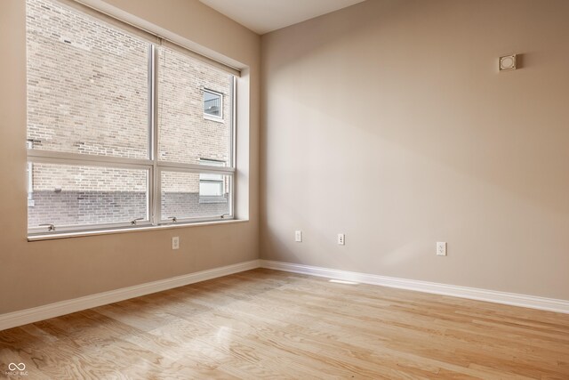 spare room featuring light hardwood / wood-style floors