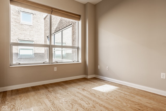 unfurnished room featuring light wood-type flooring