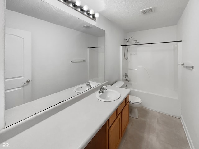 full bathroom featuring tub / shower combination, a textured ceiling, tile patterned flooring, vanity, and toilet