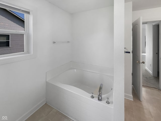 bathroom featuring a bathtub and tile patterned floors